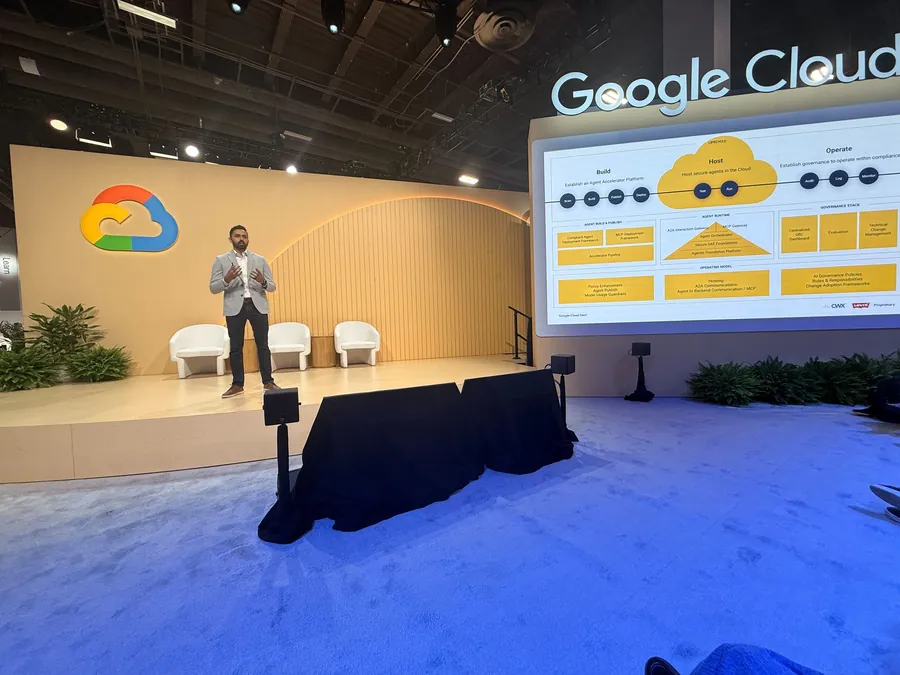 A CWX leader presenting on stage at a Google Cloud event