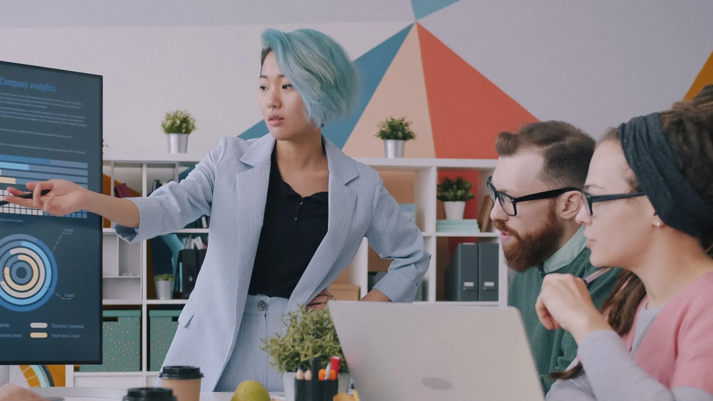 A consultant walks a team through an analytics dashboard